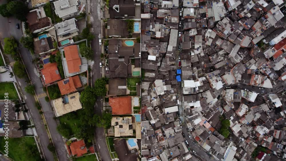 Aerial view above a wall splitting the poor from the rich in a South American metropolitan city - overhead, drone shot Aerial view above a wall splitting the poor from the rich in a South American metropolitan city - overhead, drone shot