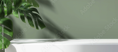 Minimal, modern white marble stone counter table, tropical monstera plant tree in sunlight on green wall background for luxury fresh organic cosmetic, skin care, beauty treatment product display 3D
