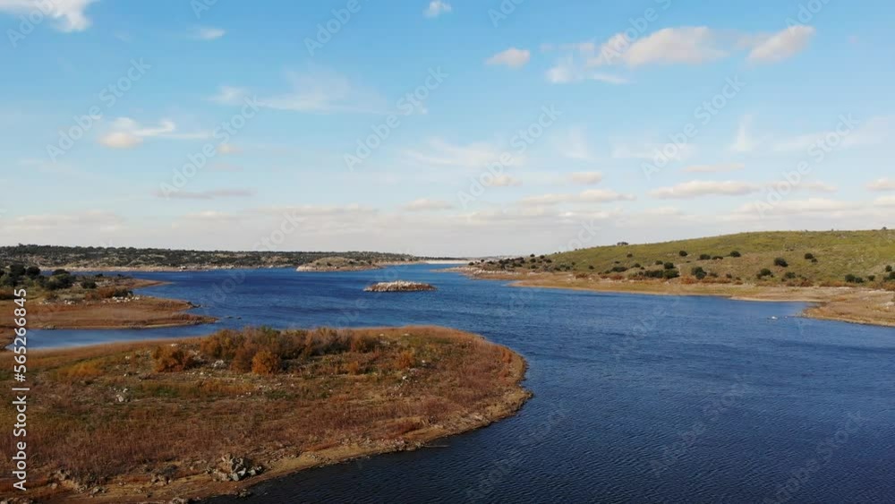 Drone Flying Over a Small Island on a Lake. Watch as a drone effortlessly glides over a picturesque small island on a tranquil lake. Drone Flying Over a Small Island on a Lake. Watch as a drone effortlessly glides over a picturesque small island on a tranquil lake.