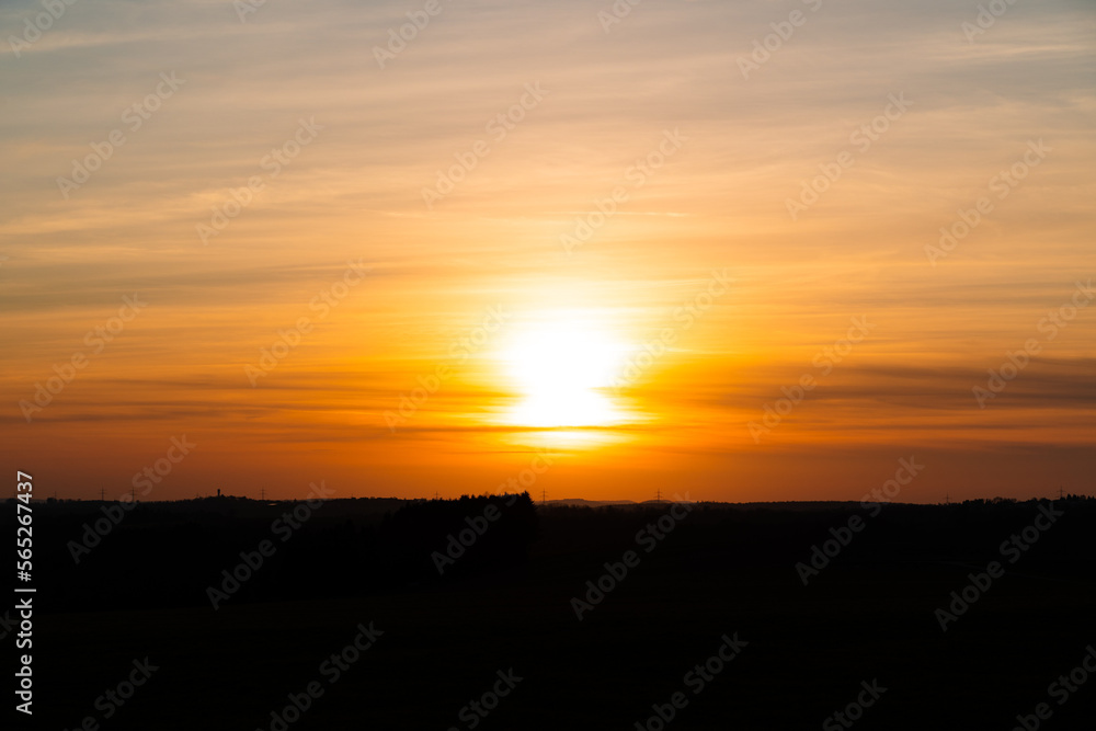 Sunset with yellow and orange sky in the countryside