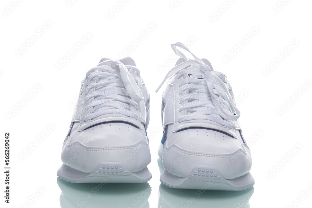 Pair of of New White Sneakers Placed Against White Background. Pair of of New White Sneakers Placed Against White Background.
