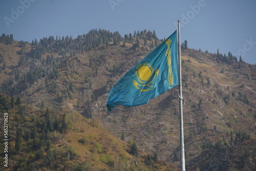 Fototapeta Naklejka Na Ścianę i Meble -  Almaty, Kazakhstan - 09.16.2022 :  The national flag of the Republic of Kazakhstan on a large flagpole in the city center.