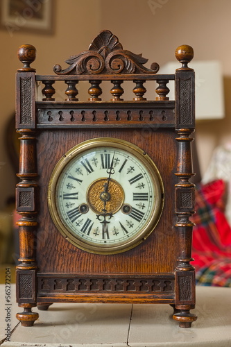 antique clock inside the home with soft focused background photo