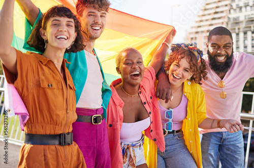Portrait, rainbow and flag with a friends outdoor together for diversity, gay pride or freedom. Support, lgbt and human rights with a man and woman friend group standing outside for equality photo