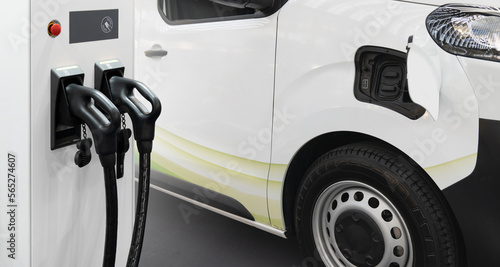 Electric delivery van with electric vehicles charging station. 