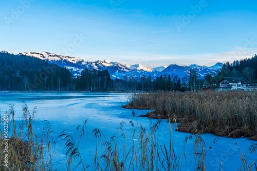 Schwarzsee lake in Kitzbuhel partly covered with ice. Winter in Austria