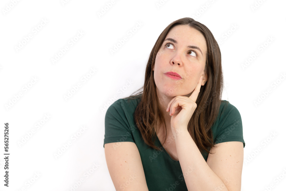 pensive woman looking at the sky with her hand on her face pensive woman looking at the sky with her hand on her face
