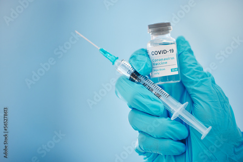 Fototapet Doctor, hands and covid vaccine for cure, healthcare or medical syringe medication to combat the virus