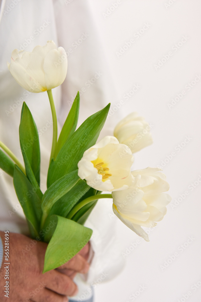 custom made wallpaper toronto digitalLoving couple holding a bouquet of tulips on a white background.