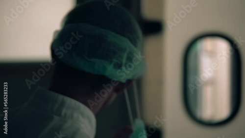 surgeon comes out of the operating room