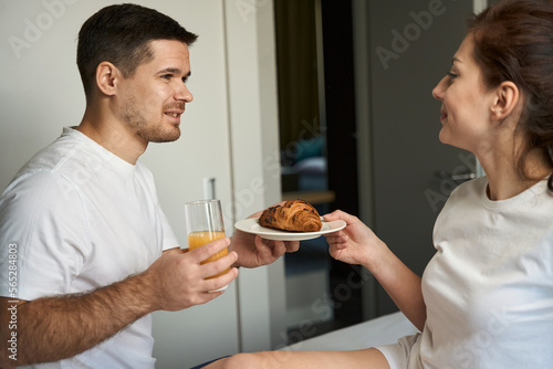 Kind man brought breakfast to his wife in bed
