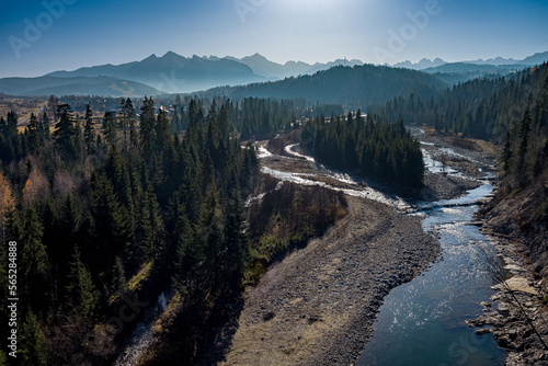 aerial view of a mountain stream, Białka Tatrzańska river with mountains in the background, High Tatras, Podhale