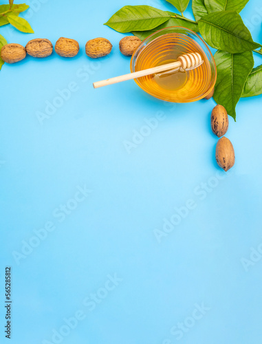 Vertical Festive background Rosh Hashanah, bowl with honey and walnuts