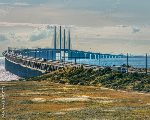 Top view of the Oresundsbron or Oresund Bridge with Copenhagen in the background. Gigantic link between Sweden and Denmark allows nations interconnection via the Oresund channel across the Baltic sea photo