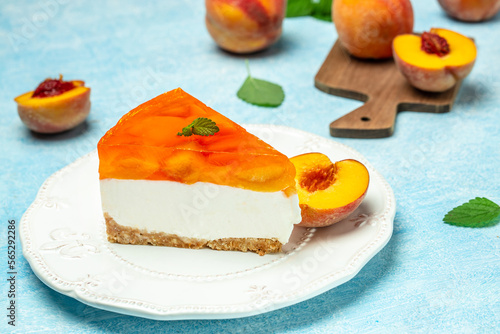 cheesecake with peaches, peache jelly, jam on a light background. banner, menu, recipe place for text, top view