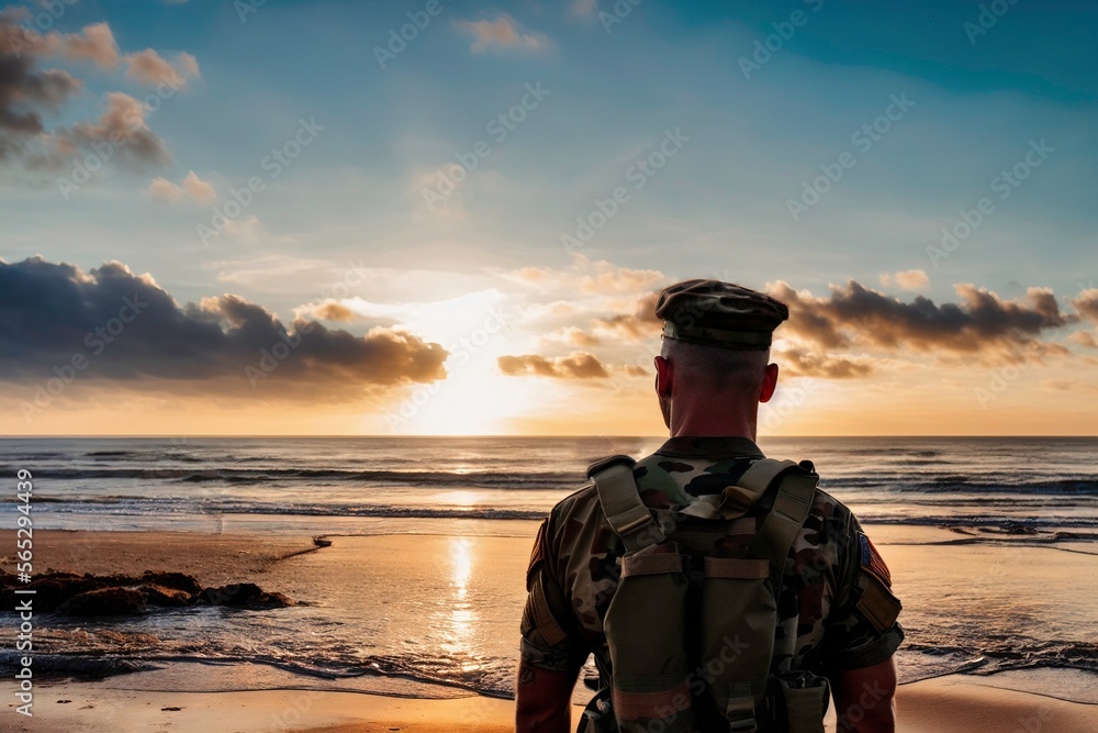 photo of back of a young soldier standing in front of a beach with a sunset photo of back of a young soldier standing in front of a beach with a sunset
