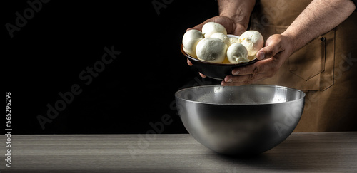 The processing Traditional Italian mozzarella  Cheesemaker  showing freshly made mozzarella. Long banner format