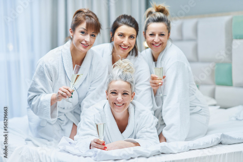 Girls with wine at spa party in the hotel