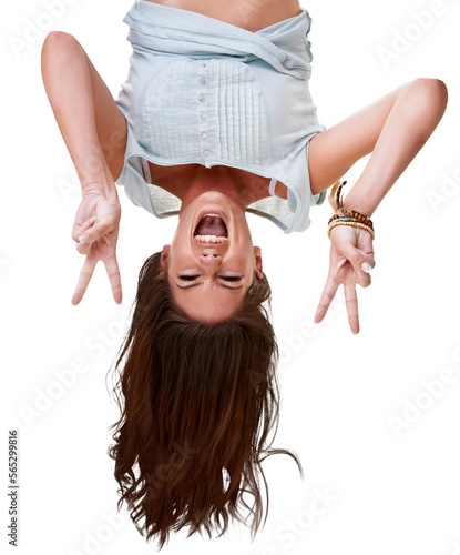 Portrait of a pretty young woman hanging herself upside down and giving a victory gesture Isolated on a PNG background.