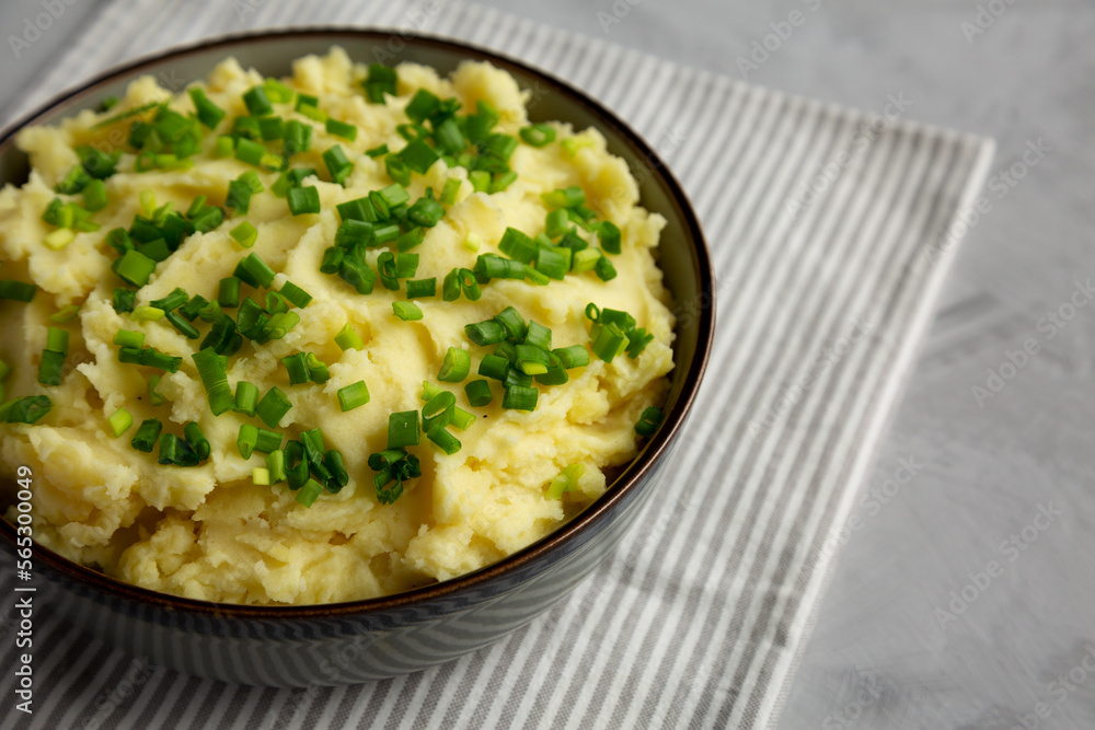 Homemade Mashed Potatoes with Chives in a Bowl, side view. Copy space. Homemade Mashed Potatoes with Chives in a Bowl, side view. Copy space.