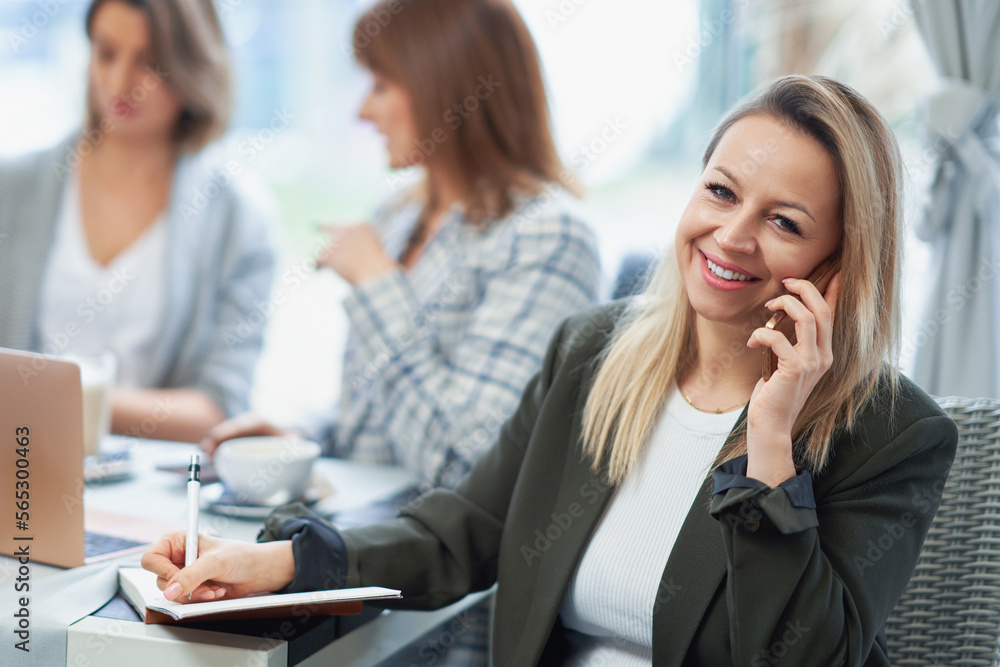 Picture of business woman with cell phone on meeting Picture of business woman with cell phone on meeting