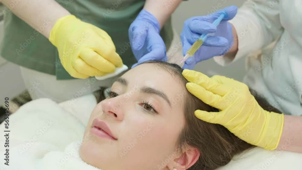 Plasma therapy of the scalp. Hair mesotherapy procedure in the modern cosmetology clinic