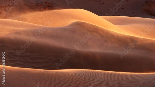 Sand blowing over dunes in wind, sandstorm in Gobi desert, Mongolia