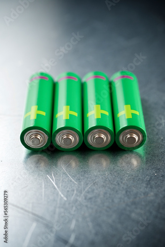 Close-up of green batteries on table photo