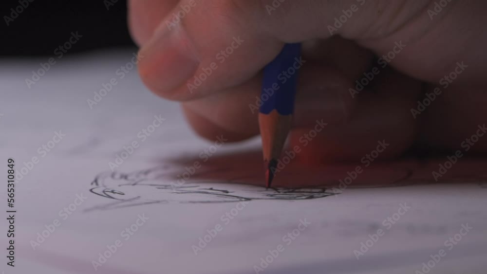 close up hand drawing using a pencil close up hand drawing using a pencil
