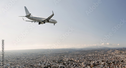 Passengers commercial airplane flying above Limassol city, Cyprus
