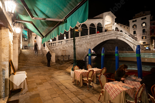 Fototapeta Naklejka Na Ścianę i Meble -  Restaurants by Rialto Bridge in Venice, Italy