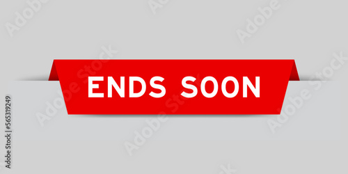 Red color inserted label with word ends soon on gray background