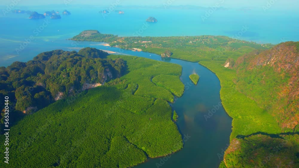 Drone flying above Mangrove forests and limestone mountains, Estuary and curve river, islands in the background. Krabi, Thailand. One of the most beautiful tropical seas in the world. Nature concept
Drone flying above Mangrove forests and limestone mountains, Estuary and curve river, islands in the background. Krabi, Thailand. One of the most beautiful tropical seas in the world. Nature concept