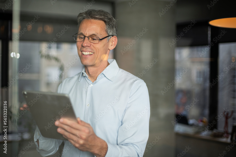 Portrait of businessman in office. Man using digital tablet. Businessman having video call. Portrait of businessman in office. Man using digital tablet. Businessman having video call.