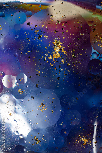 Oil on a water surface with bubbles and pieces of Gold leaf. Abstract colorful background. Close-up, not illustration © Владимир Лис