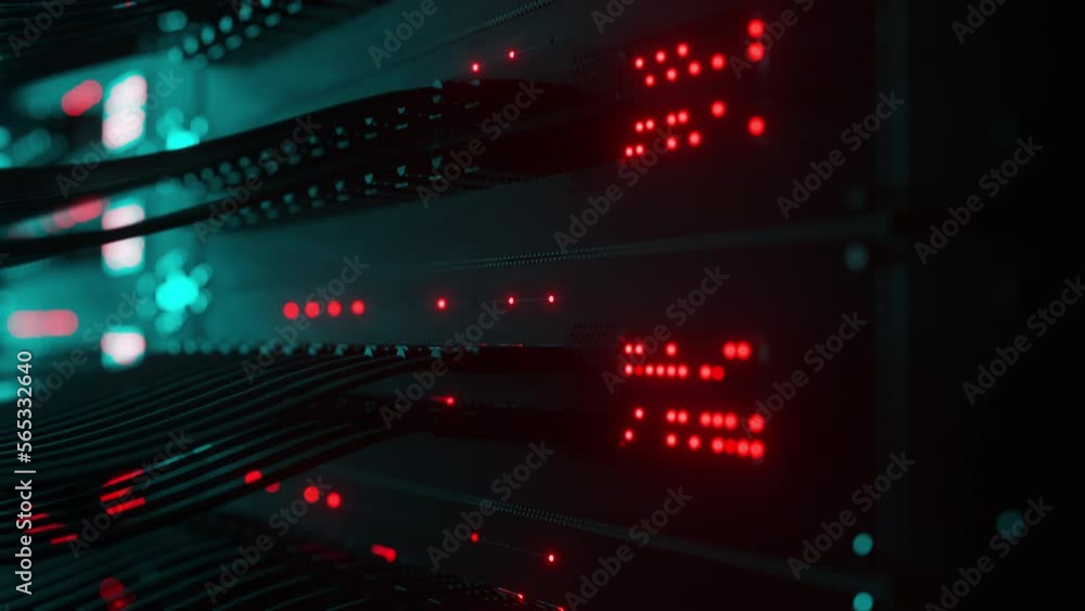 Close-up view of modern internet network switch with plugged ethernet cables. Blinking lights on internet server. Concept of big data center mining. Cloud computing and telecommunications Close-up view of modern internet network switch with plugged ethernet cables. Blinking lights on internet server. Concept of big data center mining. Cloud computing and telecommunications