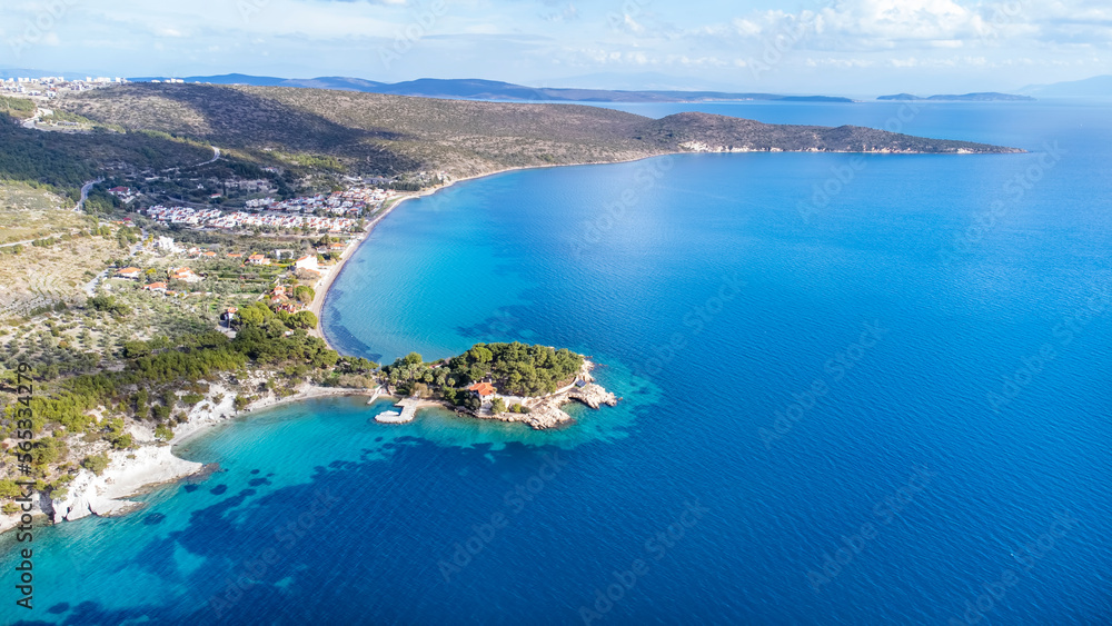 Manal Bay, which is connected to İzmir, is a peaceful and quiet resting area with its deep blue sea in Mordoğan Karaburun. Aerial view with drone. Izmir - Turkey