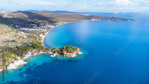 Manal Bay, which is connected to İzmir, is a peaceful and quiet resting area with its deep blue sea in Mordoğan Karaburun. Aerial view with drone. Izmir - Turkey