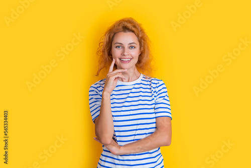 positive redhead woman portrait isolated on yellow background. portrait of young redhead woman