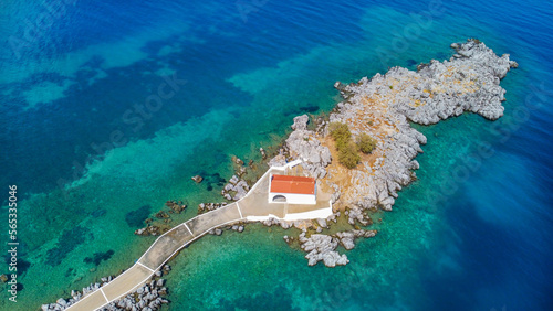 Authentic traditional Greek islands- unspoiled Chios, little church in the sea over the rocks Agios Isidoros. Eastern Aegean islands © Esin Deniz