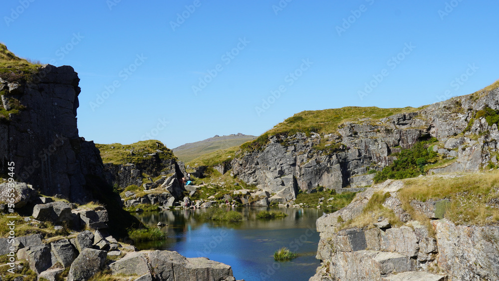 blue mountain lake between rocks and hills