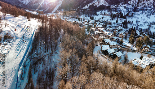 Panoramic view of Bardonecchia village from above, ski resort in the italian western Alps, Piedmont, Italy. Bardonecchia, Italy - January 2023 photo