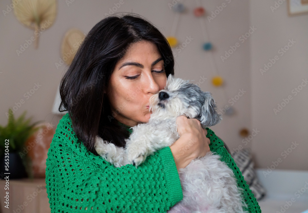 Beautiful Young Woman Hugging and Kissing her White Senior Havanese Dog at Home
Beautiful Young Woman Hugging and Kissing her White Senior Havanese Dog at Home