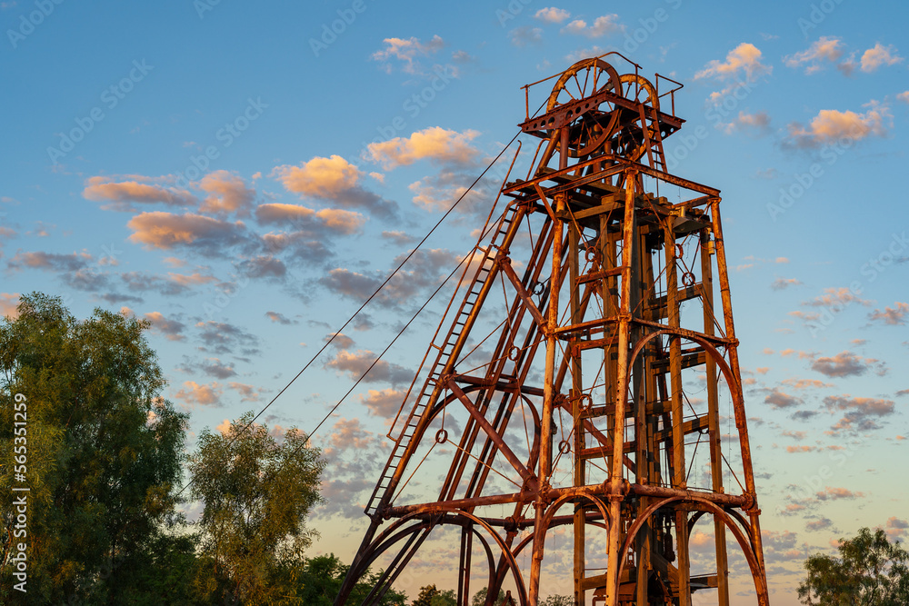 Looking up at a rusty mining poppet head tower Looking up at a rusty mining poppet head tower