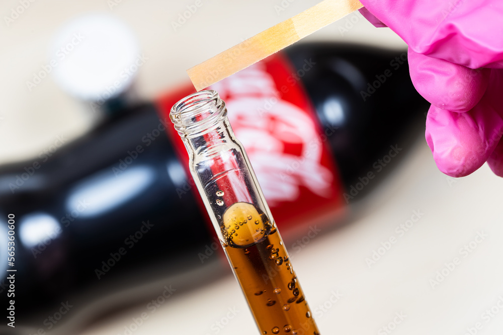 Moscow, Russia January 12, 2023 measuring of pH level of Coca Cola