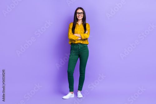 Full body photo of cheerful nice lady crossed arms toothy smile isolated on violet color background