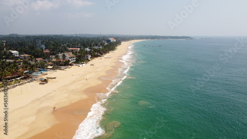 Sri Lanka Southern beaches captured by a drone. Indian blue ocean with clear blue sky  warm tropical temperature  