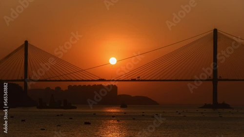 Sunset on suspension bridge in Hong Kong city