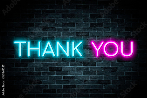 Thank You neon banner on brick wall background.
