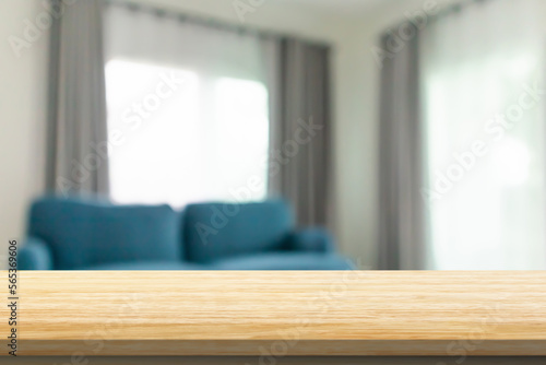 Empty wood table top with blur room interior with window curtain background